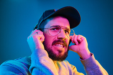 Image showing Enjoying his favorite music.