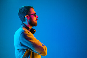 Image showing Enjoying his favorite music.