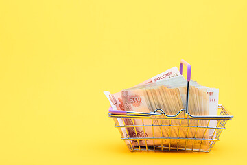 Image showing A grocery basket full of five thousandth bills