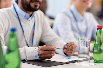 Image showing businessman with papers at business conference