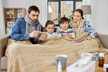 Image showing family with ill children having fever at home