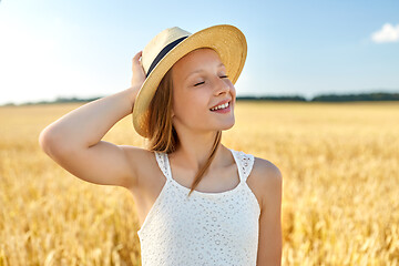 Image showing portrait of girl in straw hat on field in summer