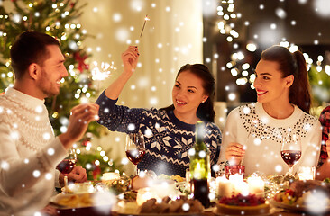 Image showing happy friends celebrating christmas at home feast