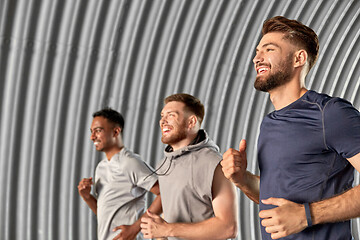 Image showing young men or male friends running outdoors