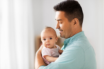 Image showing middle aged father with baby daughter at home