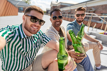 Image showing men drinking beer and taking selfie on street