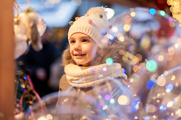 Image showing happy little girl at christmas market in winter