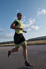 Image showing triathlon athlete running on morning trainig