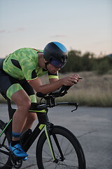 Image showing triathlon athlete riding a bike