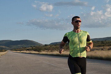 Image showing triathlon athlete running on morning trainig