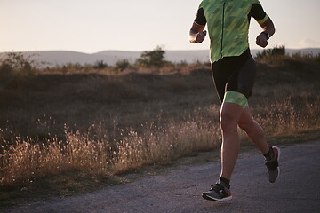 Image showing triathlon athlete running on morning trainig