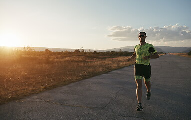 Image showing triathlon athlete running on morning trainig