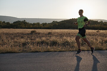 Image showing triathlon athlete running on morning trainig