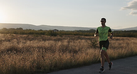 Image showing triathlon athlete running on morning trainig