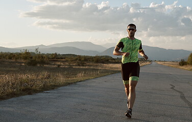 Image showing triathlon athlete running on morning trainig