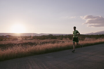 Image showing triathlon athlete running on morning trainig