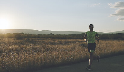 Image showing triathlon athlete running on morning trainig