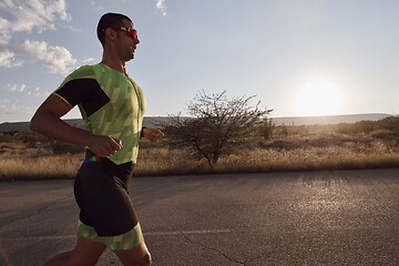 Image showing triathlon athlete running on morning trainig