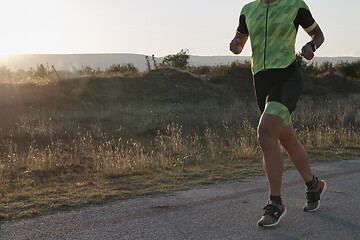 Image showing triathlon athlete running on morning trainig