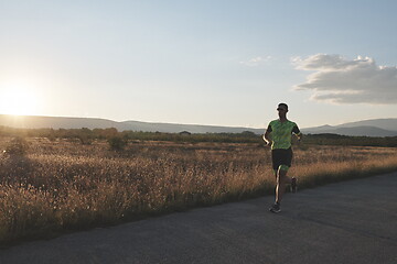 Image showing triathlon athlete running on morning trainig