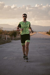 Image showing triathlon athlete running on morning trainig