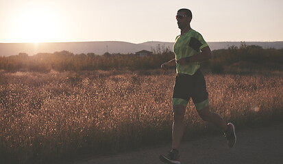 Image showing triathlon athlete running on morning trainig