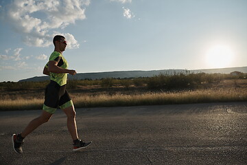 Image showing triathlon athlete running on morning trainig