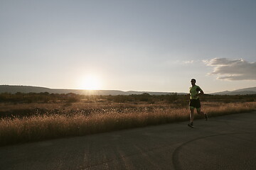 Image showing triathlon athlete running on morning trainig