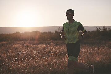 Image showing triathlon athlete running on morning trainig