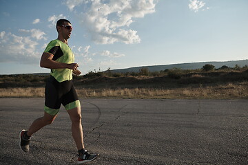 Image showing triathlon athlete running on morning trainig