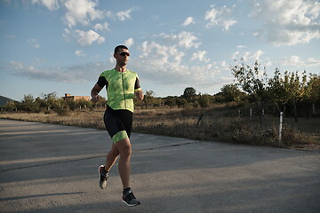 Image showing triathlon athlete running on morning trainig