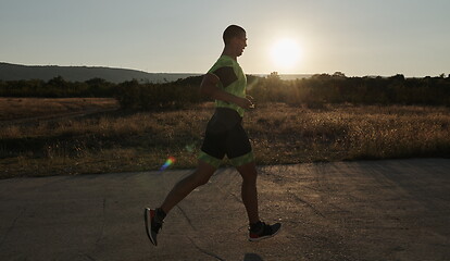 Image showing triathlon athlete running on morning trainig