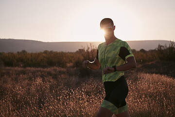 Image showing triathlon athlete running on morning trainig