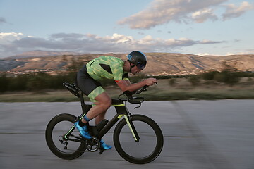 Image showing triathlon athlete riding a bike