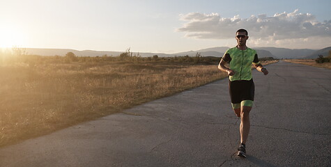 Image showing triathlon athlete running on morning trainig