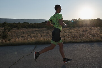 Image showing triathlon athlete running on morning trainig