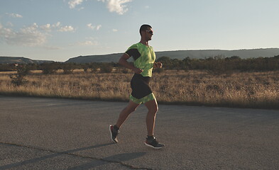 Image showing triathlon athlete running on morning trainig