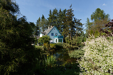 Image showing Beautiful rural house in spring garden