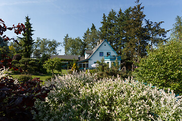 Image showing Beautiful rural house in spring garden