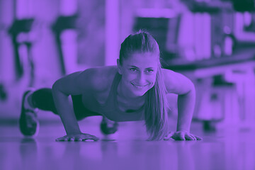 Image showing warming up and doing some push ups a the gym