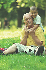 Image showing happy grandfather and child in park