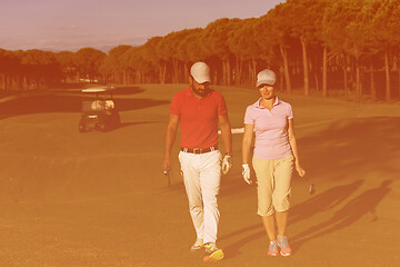 Image showing couple walking on golf course