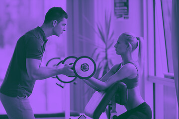 Image showing young sporty woman with trainer exercise weights lifting