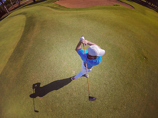 Image showing top view of golf player hitting shot