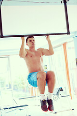 Image showing handsome young mand working out in gym