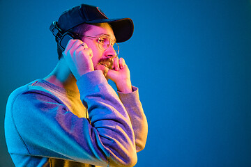 Image showing Enjoying his favorite music.