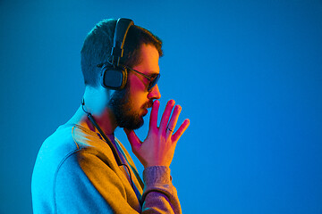 Image showing Enjoying his favorite music.