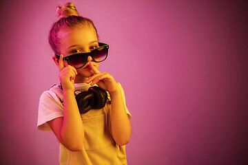 Image showing Young girl with headphones enjoying music