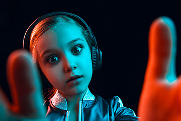 Image showing Young girl with headphones enjoying music