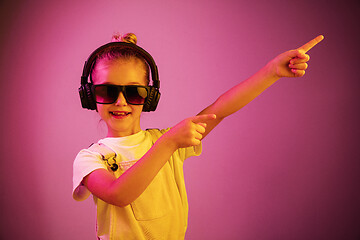 Image showing Young girl with headphones enjoying music